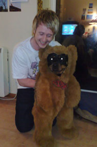 rottweiler dog in fancy dress dressed as an ewok, or teddy bear.
